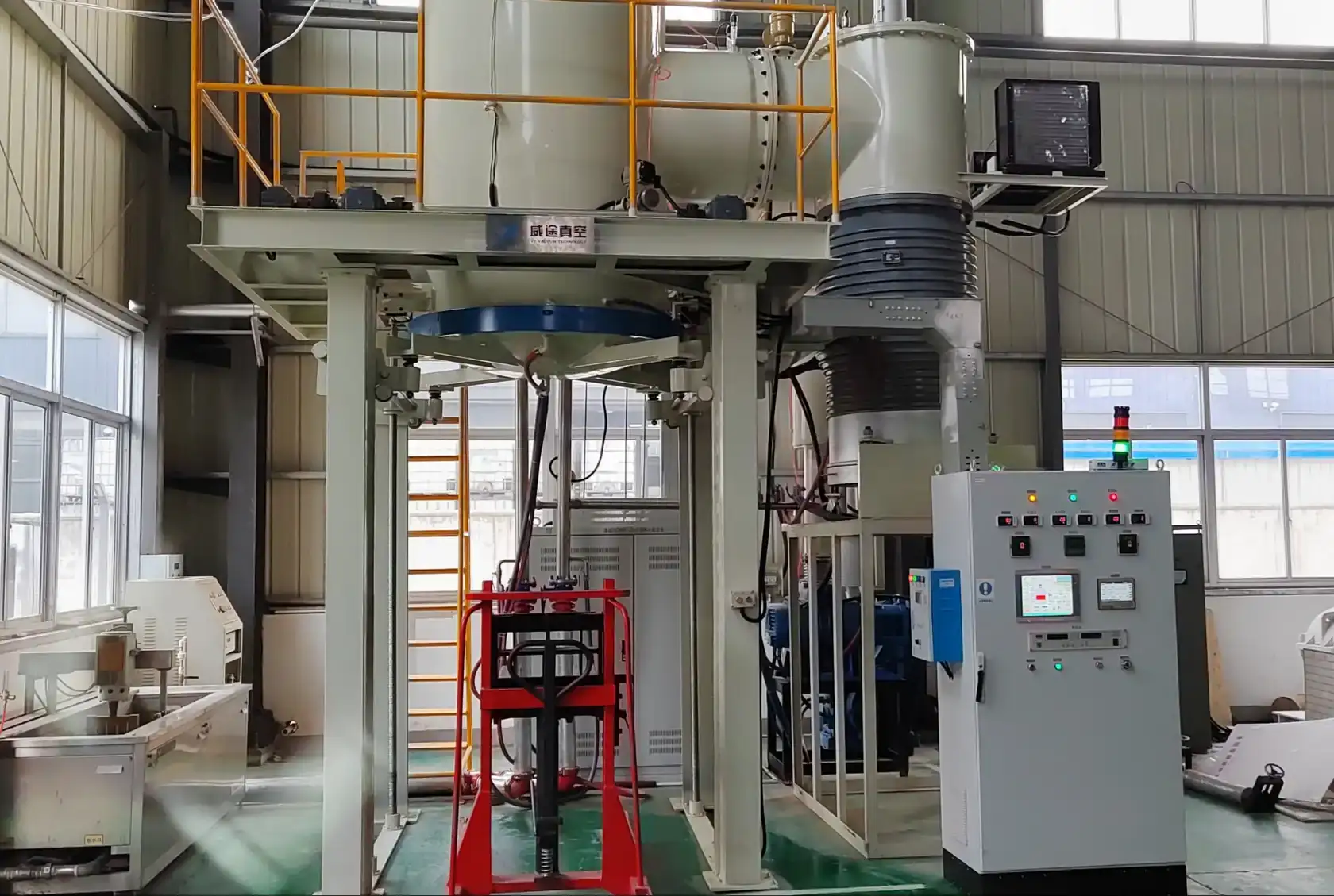 Bottom loading lift assembly and electrical control cabinet on a VTSL vacuum furnace