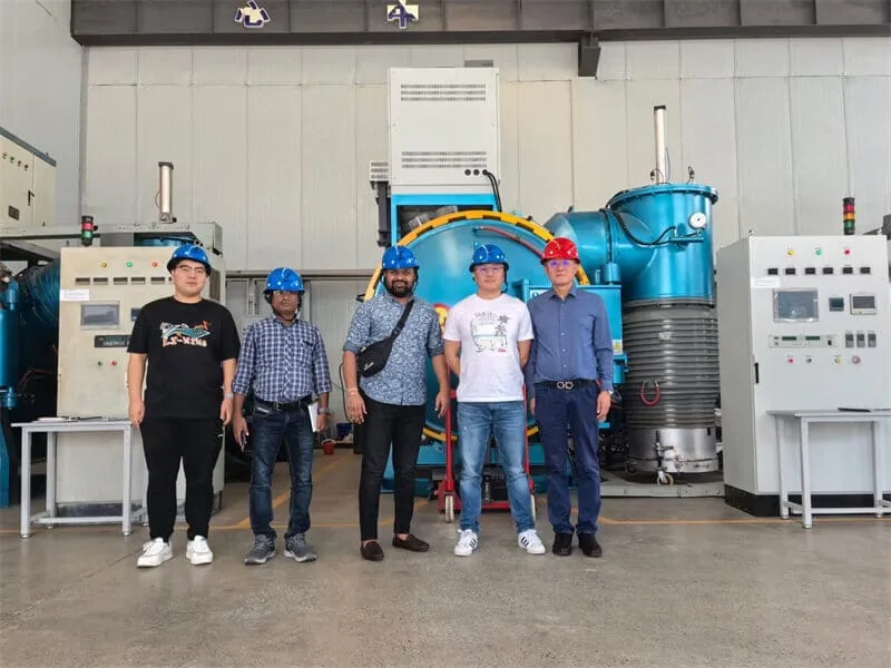 Customer team inspecting vacuum furnace equipment at SYNHTE