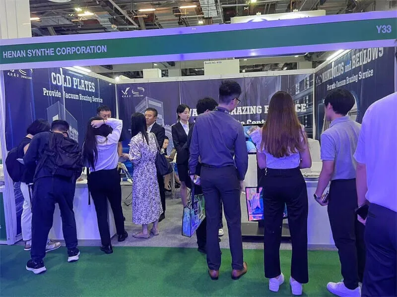 SYNHTE representatives meeting visitors at an exhibition