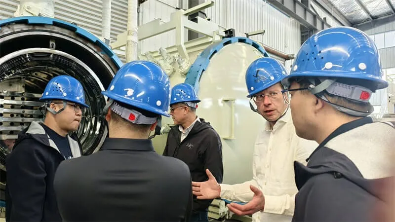 SYNHTE team reviewing vacuum furnace requirements at a customer facility